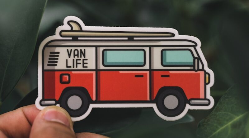 person holding red and white toy car
